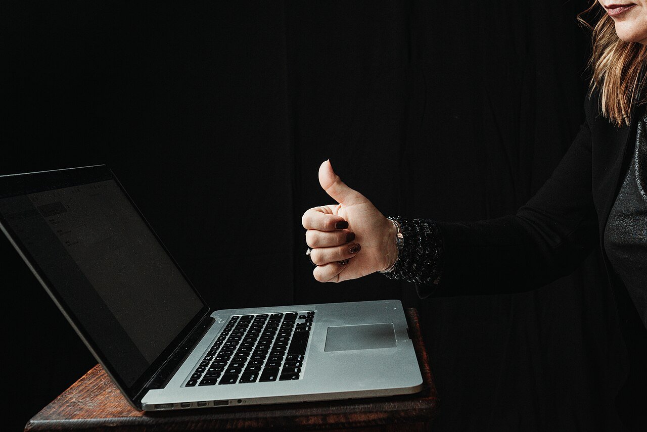Reader scrolling through movie articles in the UploadArticle.com movies section on a laptop