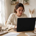 Person reading OnlyWorkMoods.com articles about work and productivity on a laptop